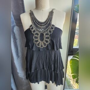 Elegant Black Ruffled Blouse with Intricate Neckline